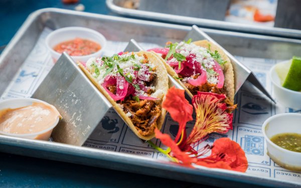 Hand-rolled corn tortillas stuffed with beef, and toppings